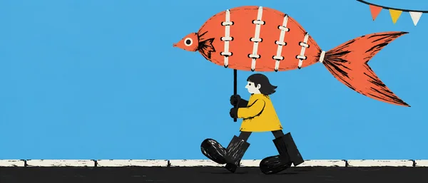 A marcher in a yellow tunic steps left along a pale curb, holding a large coral fish puppet with a forked tail and white seam stitches; three pennants hang at…