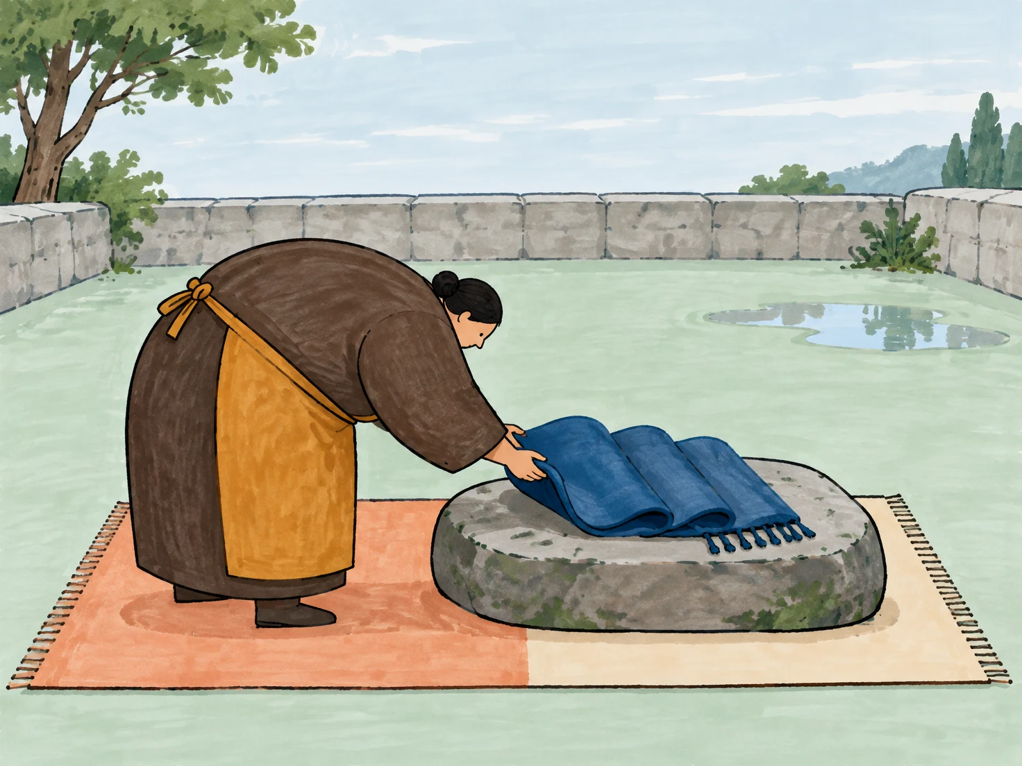 A bowed weaver in an ochre apron places a blue, folded textile with fringe on a broad stone set on a two-tone rectangular mat in a pale mint courtyard.