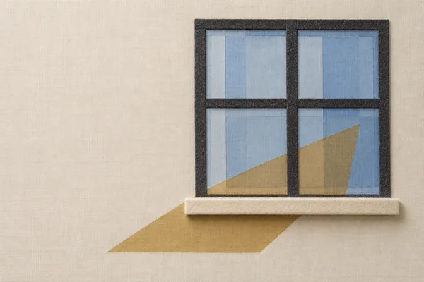 A layered-fabric composition shows a charcoal-framed four-pane window with translucent blue glazing and an ivory felt sill on a textured cream background; an…