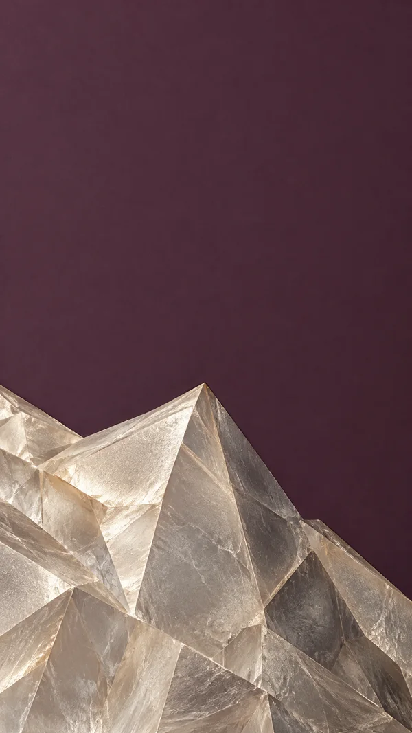 A large formation of translucent champagne-silver angular crystal facets rises from the bottom of a portrait image against a broad dusty aubergine field, with…