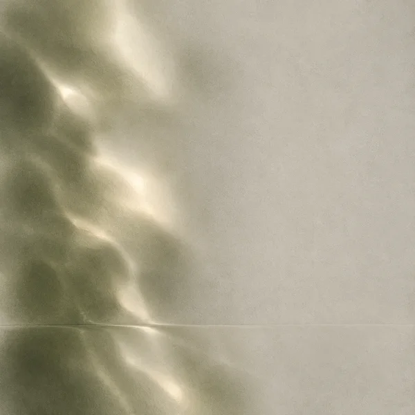 Square abstract artwork with a softly blurred olive-green field and warm pearly light streaks along the left side, set against a pale textured grey-beige…