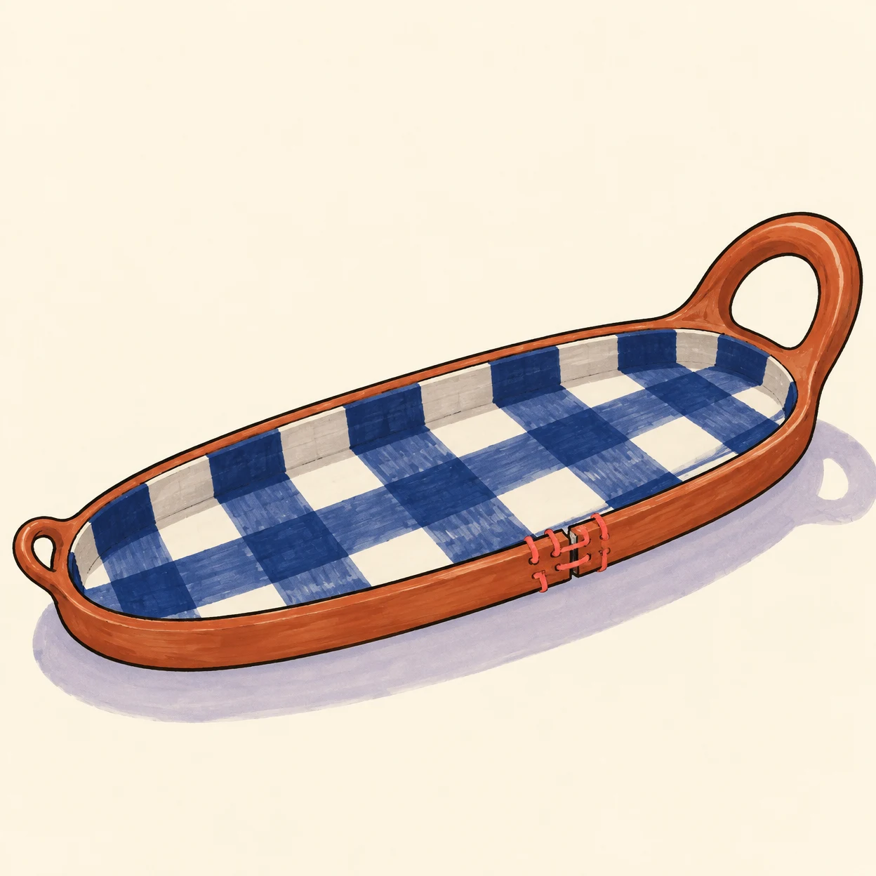 A long terracotta-rimmed serving tray with a large loop handle and a small opposite handle sits diagonally on a warm cream surface.