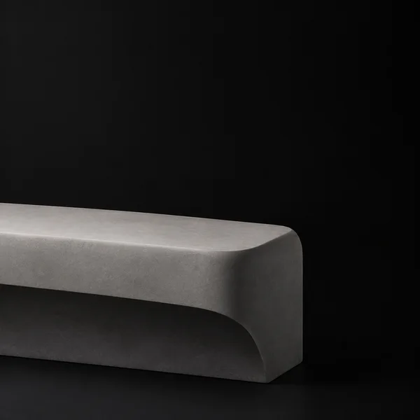 A broad ash-grey slab-like form with a rounded front lip and dark recessed underside extends in from the left across a black field; its rounded end is visible…
