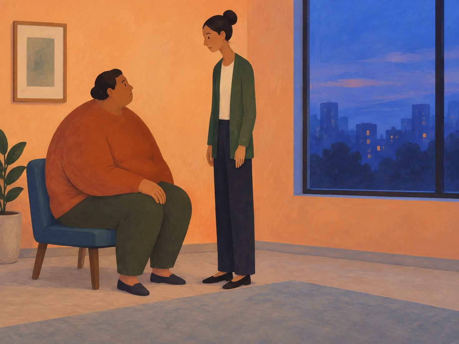 A seated adult with a broad, rounded build looks up at a tall clinician standing beside them in a warm-toned consultation room.