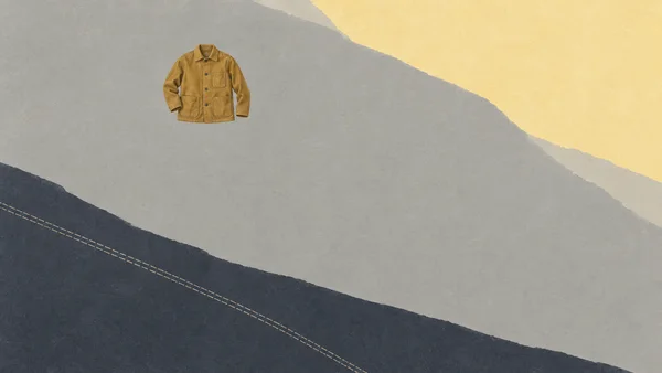 An ochre chore jacket with three patch pockets and dark buttons sits in the upper-left area against layered grey planes, a pale yellow shape at upper right…