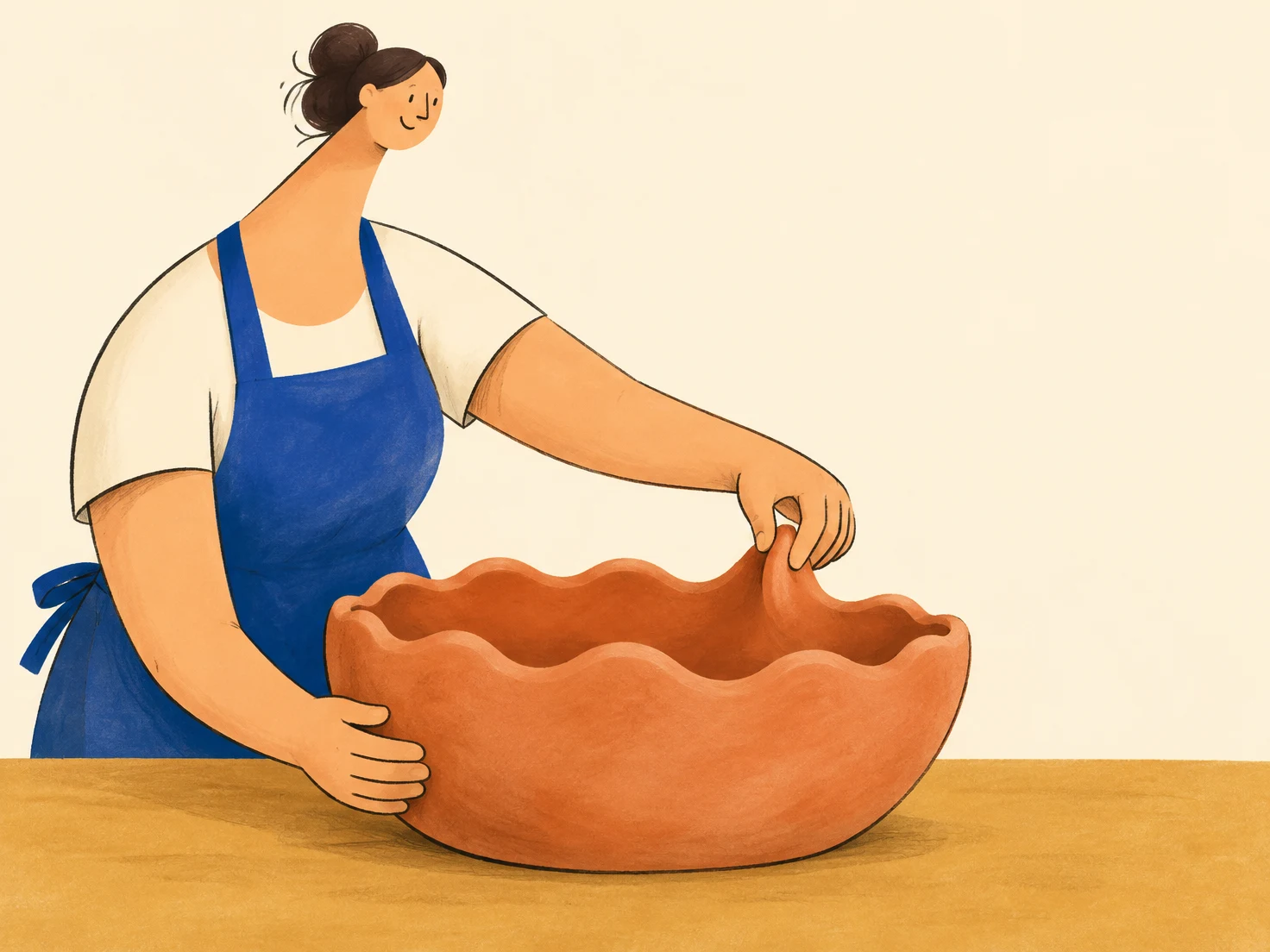 A smiling woman in a cobalt apron pinches the scalloped rim of a large terracotta bowl while steadying its side on an ochre table, against a warm cream…