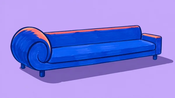 A long cobalt-blue sofa with an oversized rolled left arm and a small square right arm sits against a lilac background, with coral accents along the upholstery…