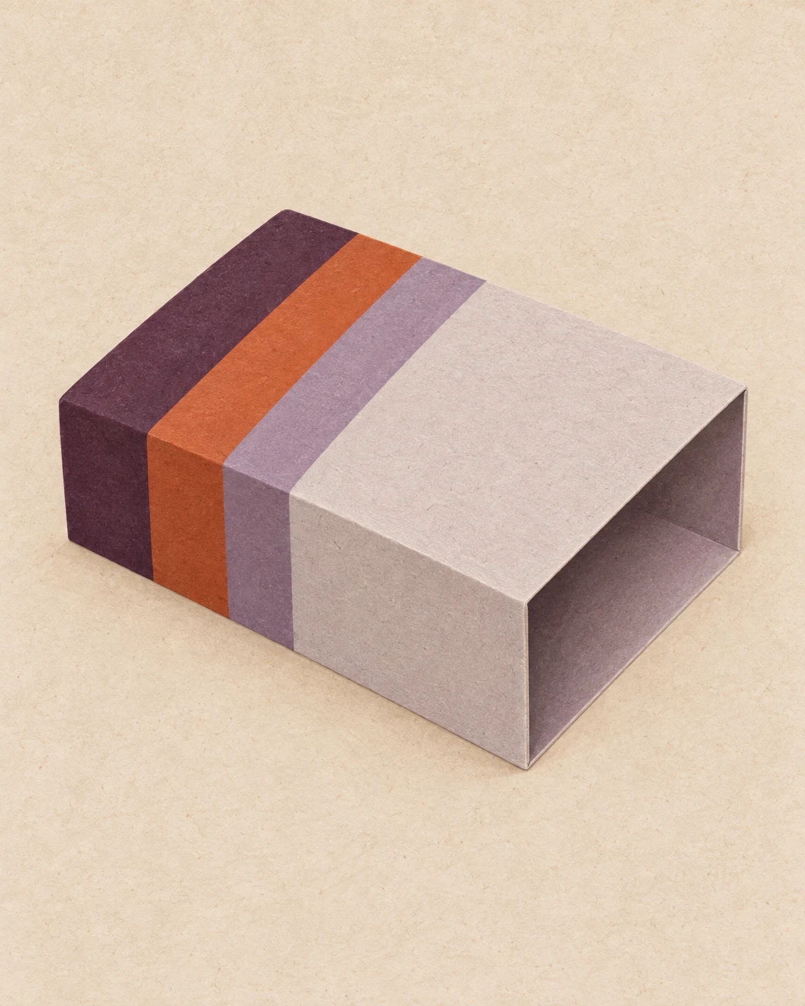 A hollow rectangular paperboard sleeve lies at an oblique angle on a warm, textured cream background.