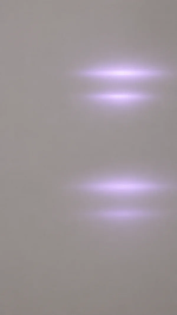 A vertical warm-grey abstract field with four soft lavender horizontal light pulses arranged in two pairs just right of centre, separated by a broad empty…