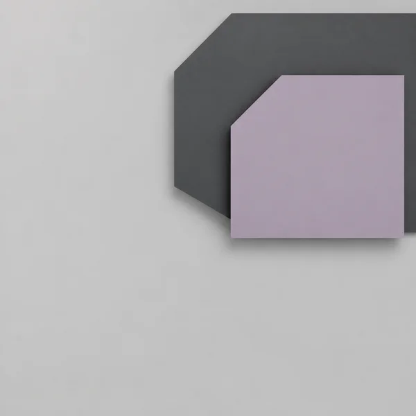A matte graphite polygon cropped by the top and right edges sits behind a smaller dusty-lavender polygon in the upper-right area, with soft shadows on a…