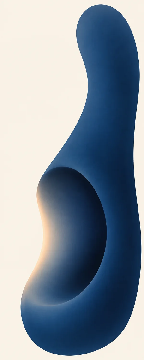 A tall deep-blue organic form with a large rounded hollow and a soft apricot glow along its left rim stands against a warm ivory background, leaving broad open…