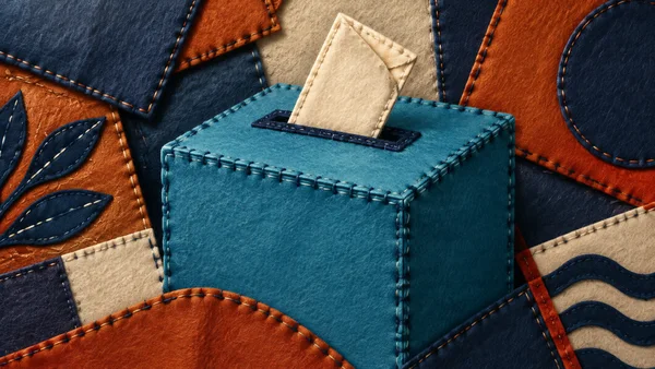 A large cyan felt ballot box in three-quarter view has a folded cream ballot partly inserted into a dark indigo slot, surrounded by overlapping rust, indigo…