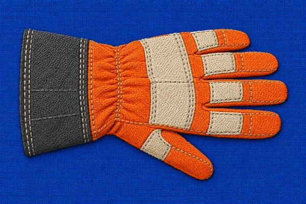 A single safety-orange work glove lies horizontally on a saturated blue woven background, with a charcoal cuff at left, four fingers pointing right, and the…