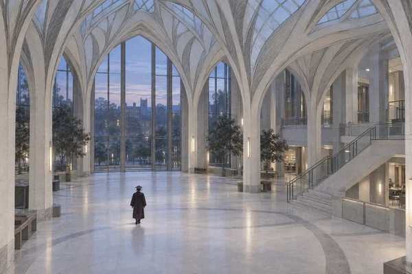 A lone graduate in a dark plum gown and mortarboard stands in a spacious university atrium with pale branching arches, tall windows, a broad stone floor, and a…