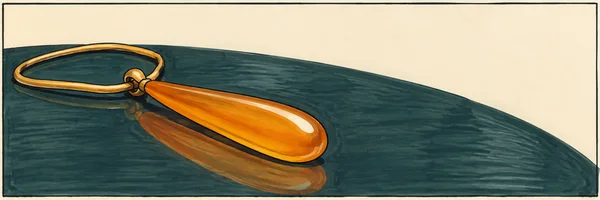 A long amber-orange pendant on a broad gold oval chain lies diagonally across a dark teal tabletop, with an orange reflection beneath it and open ivory space…