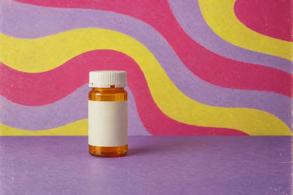An amber prescription bottle with a ribbed white cap and blank cream label stands slightly left of center on a violet tabletop, against a painted backdrop of…
