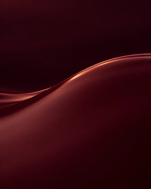 A close abstract view of a glossy oxblood liquid surface, with a copper-lit curved swell crossing the frame beneath a broad plum-black field.