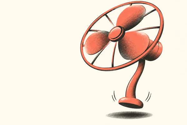 A coral pedestal fan with a large oval head, dark protective rim and spokes, a long bowed stem, and a small base floats above a charcoal oval shadow on a warm…