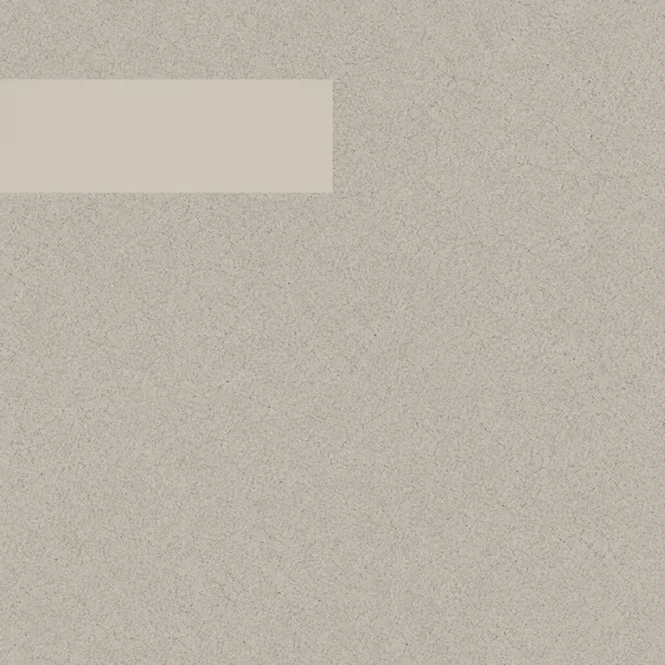 A warm greige square with dense charcoal speckling and a smooth, lighter horizontal rectangle extending from the left edge near the top; the rectangle ends in…