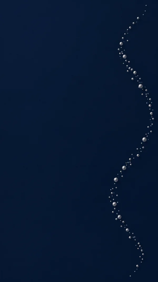 A narrow trail of silver spherical particles bends down the right side of a dark blue vertical background, leaving most of the left side empty.