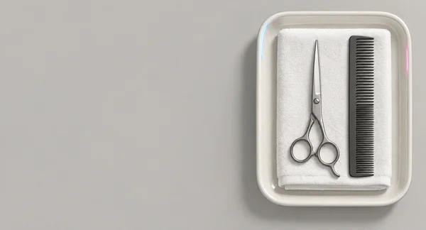 A top-down salon workstation shows a white folded towel, steel haircutting scissors and a dark comb arranged inside an ivory ceramic tray on a warm grey…