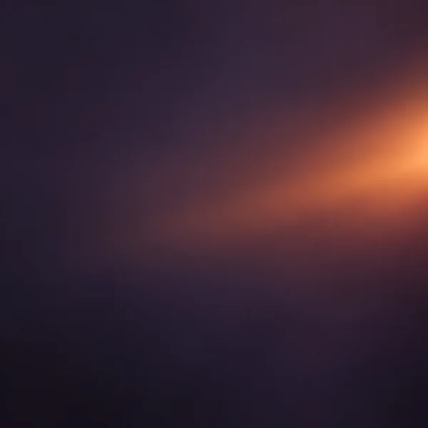 A soft copper and amber glow enters from the right side of a dark violet-charcoal gradient, fading into the surrounding tones while the left side remains…