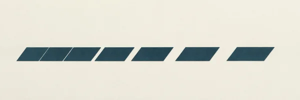 Seven dark petrol-blue parallelograms form a horizontal row across a warm ivory, subtly textured field, with broad open space above and below.