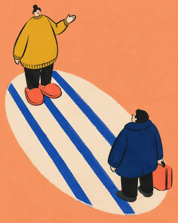A host in an oversized mustard sweater and coral slippers raises a hand toward a guest in a navy coat holding a coral suitcase; they face each other on a cream…