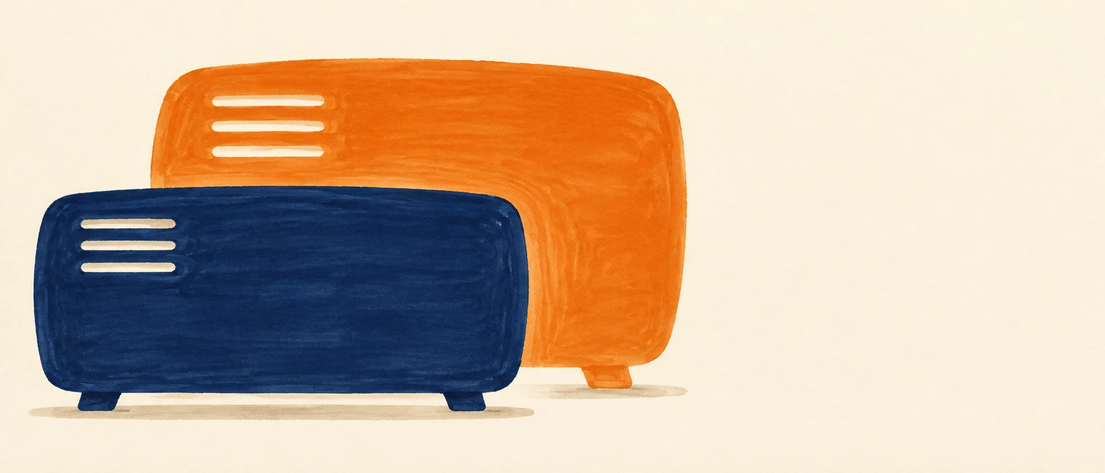 A squat navy rounded rectangular heater with three horizontal vents and two small feet overlaps a larger burnt-orange echo of the same shape on warm ivory…