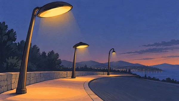 Three charcoal streetlights of different sizes line a curved peach-colored waterfront pavement at dusk, with amber pools of light, dark trees, distant hills…
