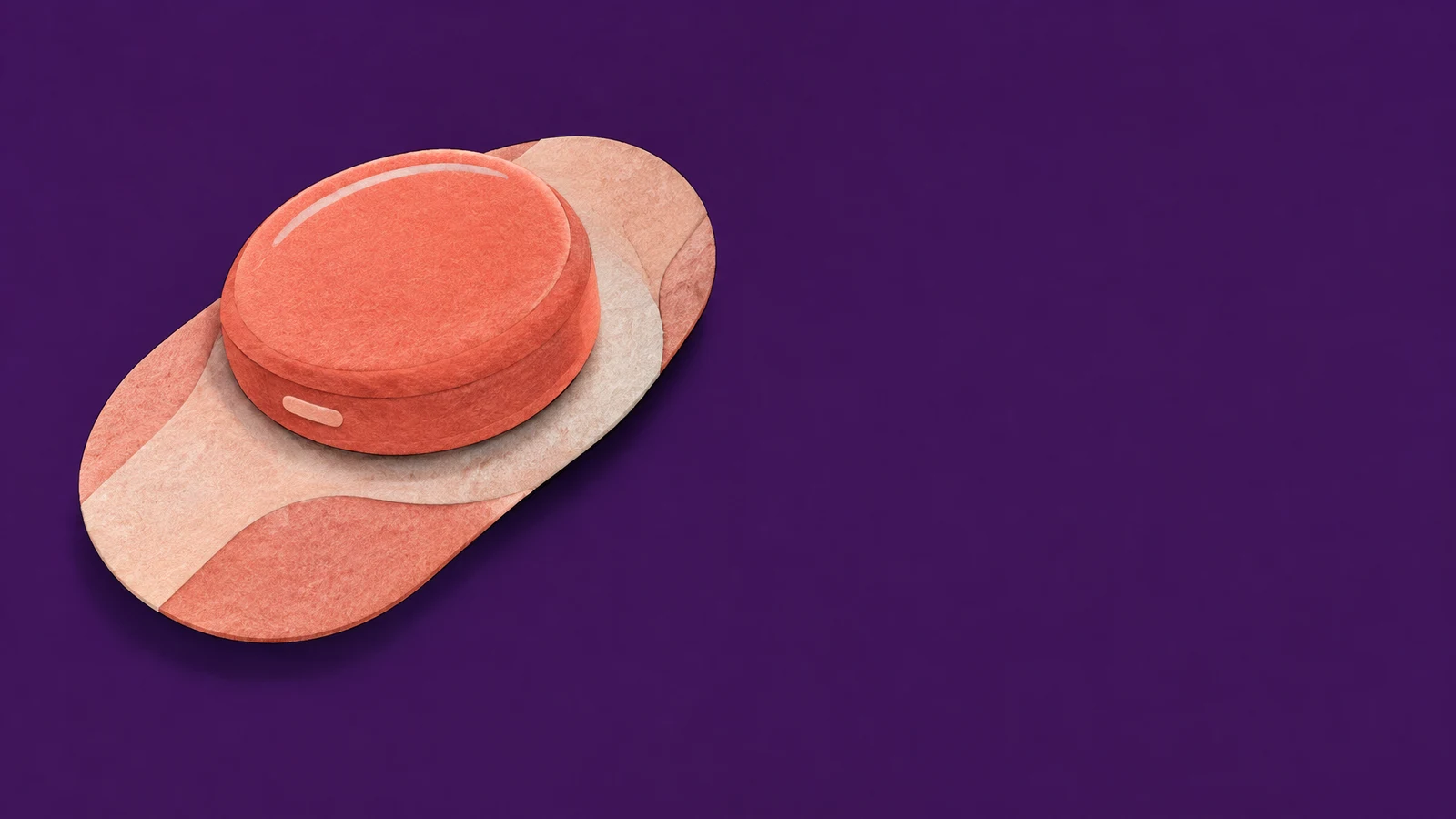 A coral puck-shaped glucose sensor sits unattached on a layered, elongated peach-and-coral adhesive backing against a deep-purple background, with open space…