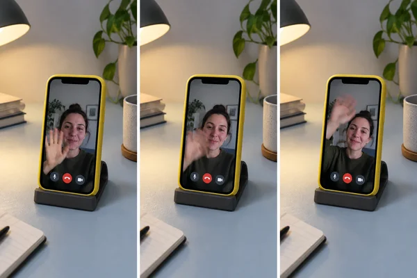 Three side-by-side views show a yellow-cased smartphone in a dark cradle on a pale blue desk.