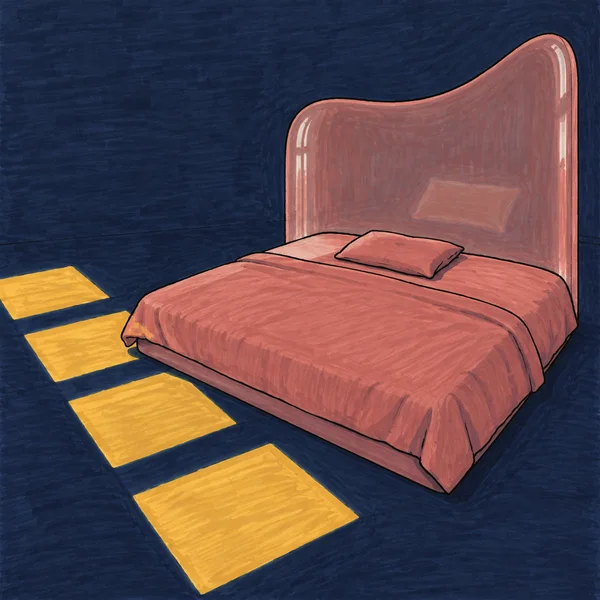 A low, wide bed with a rose blanket and one pillow sits against a tall dusty-rose headboard in a dark navy room.