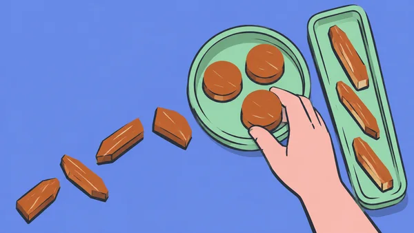 A large pale pink hand reaches toward a rust-coloured disc in a round mint tray, beside a long mint tray holding three rust-coloured offcuts.