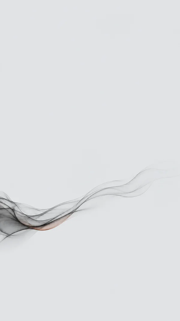 A translucent graphite-grey smoke ribbon with layered wisps crosses the lower half of a pale grey vertical background, rising toward the right; a faint copper…