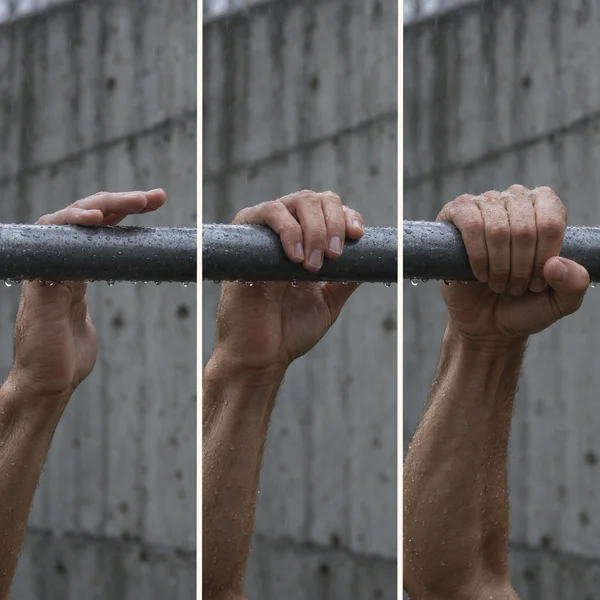 Three vertical photographs show a rain-speckled hand progressing from touching a wet steel bar to curling around it and forming a firm grip, against a blurred…
